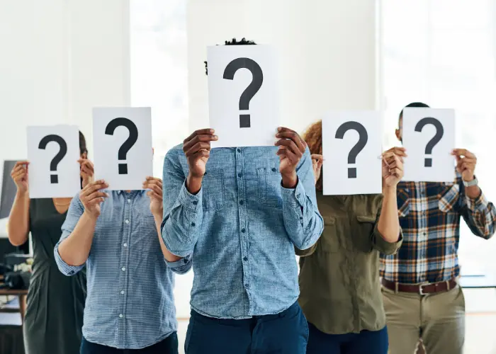 Workflow4biz image of a a bunch of people holding question mark signs infront of their faces